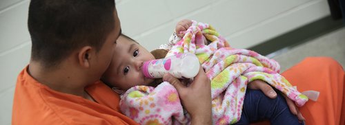 inmate is nursing a baby