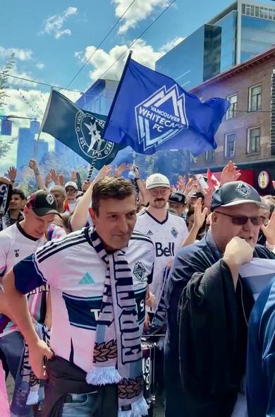Vancouver Whitecaps fans doing the pre-game partying on the Pedestrian Street before marching to the stadium with the Southsiders leading the charge/chant (other fans enjoying the game on the patios with TVs).