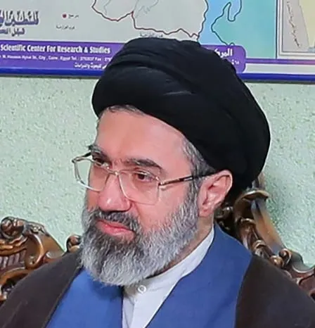 Portrait of Mojtaba Khamenei, with hat and beard.