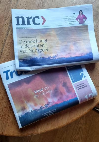 Front pages of Trouw and NRC with headlines and photos