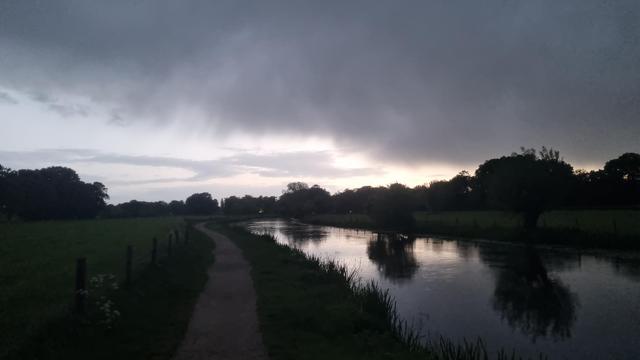 Little river under dark cloud
