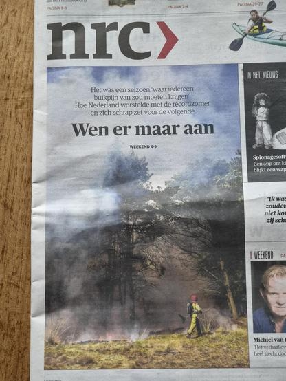 Front page with that headline in Dutch and photo of wildfire with fireman.