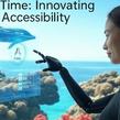 Woman with a prosthetic arm interacts with a floating digital interface; an ocean, dolphin and coral reef appear behind her. Text at top reads 'AI Time: Innovating Accessibility.'