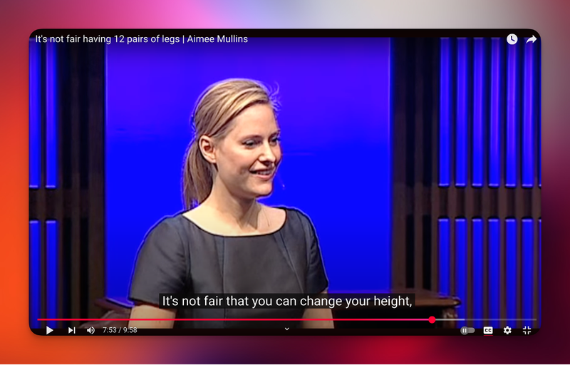 Aimee Mullins on the TED stage. A subtitle reads: It's not fair that you can change your height.