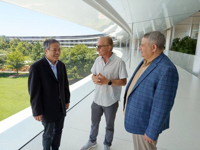 Jennison, Joz and Joe chatting while looking out at the Apple Park garden.