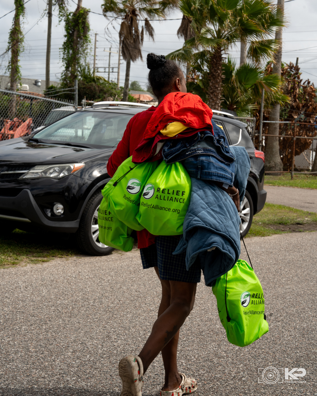 Relief Alliance distributing food clothing hygiene kits and essential supplies during an outreach in Orlando Florida