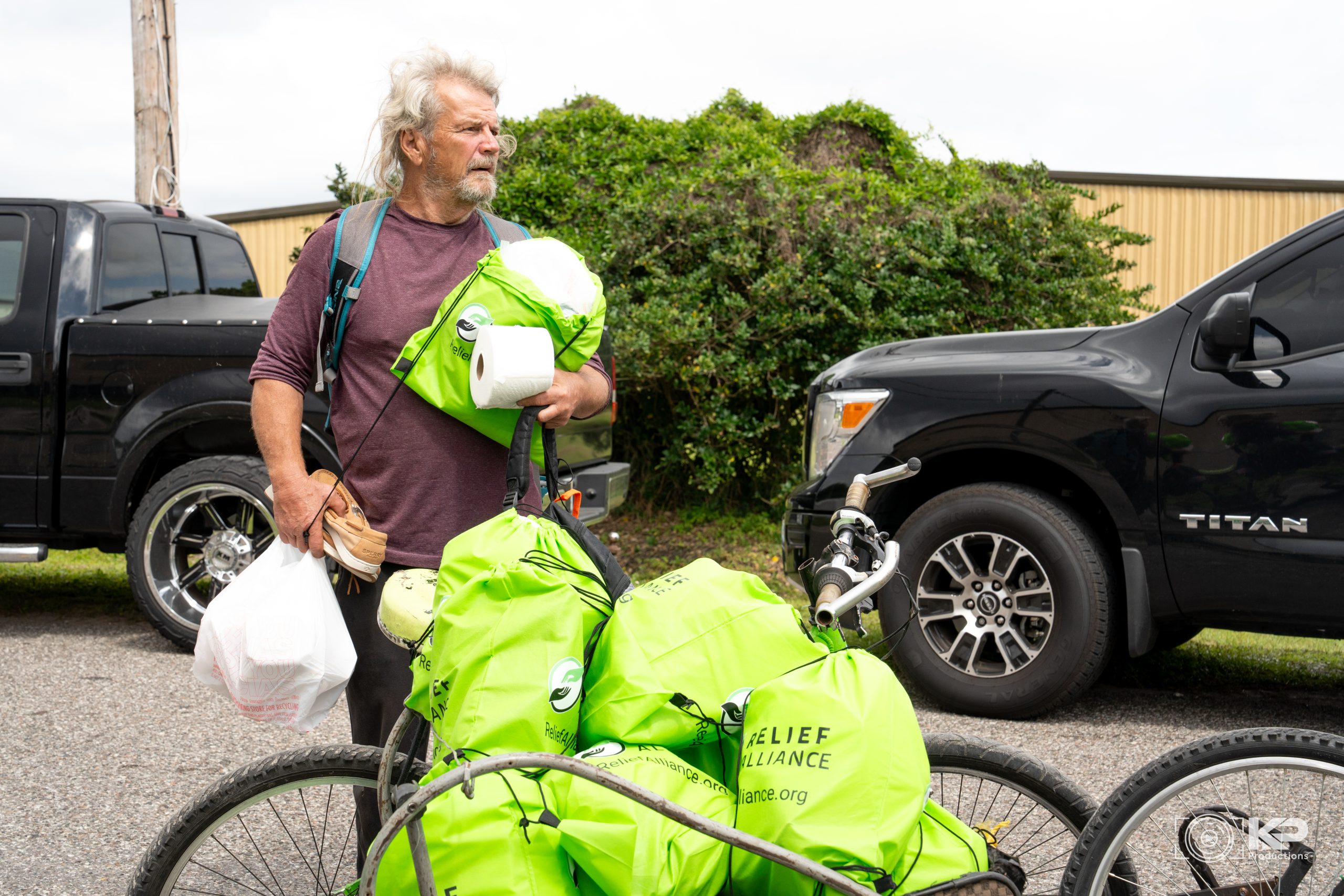 Individual receiving food and essential supplies from Relief Alliance during a homeless outreach in Orlando Florida