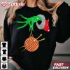 Grinch Hand Holding Ball Of Wool And Knitting Needles Christmas T Shirt (1)