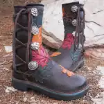 Beautiful handcrafted moccasins with intricate leaf and floral designs.