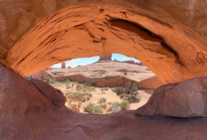 Guests discovering geological wonders along paved trails at Arches National Park.