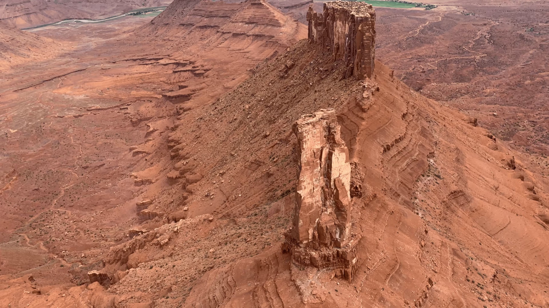 Spires loom over the desert floor on the helicopter tour