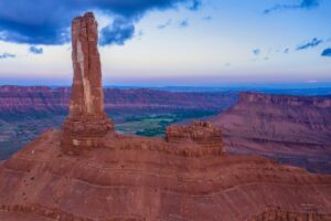 Aerial view of Castleton Tower rising above Castle Valley near Moab Utah