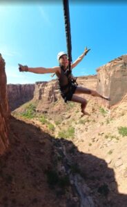 Guest laughing mid-air during Moab Rope Swing