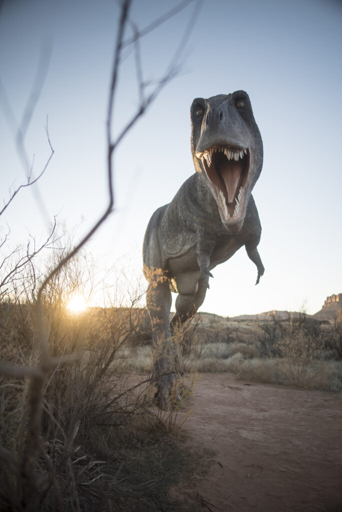 T-Rex dinosaur replica at sunset at Moab Giants