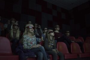 Guests watching 3D dinosaur presentation at Moab Giants theater