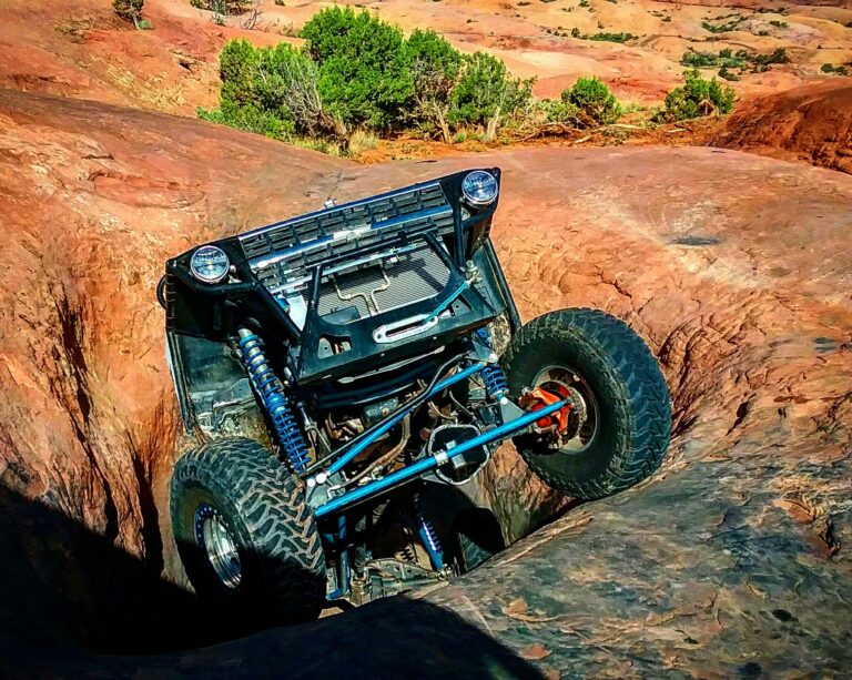 4x4 emerging from sandstone obstacle on Hell’s Revenge trail