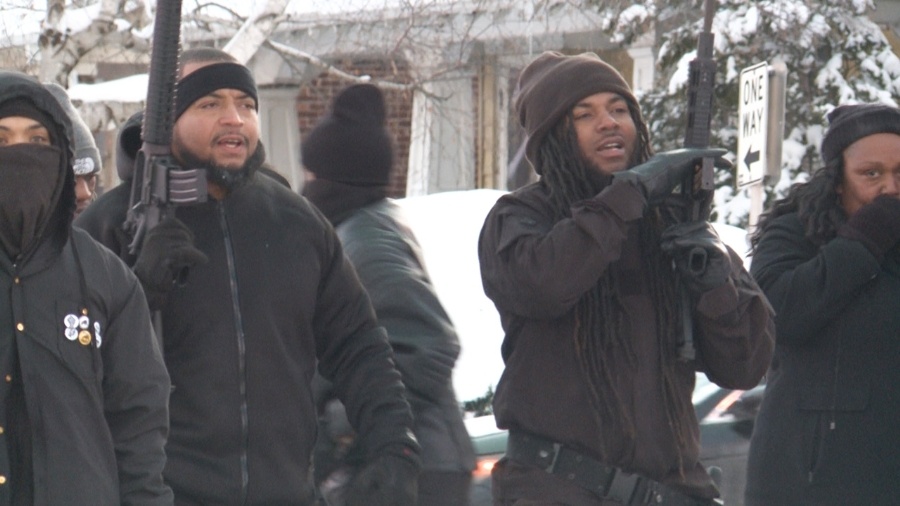 Black Panthers of Milwaukee carrying assault rifles.