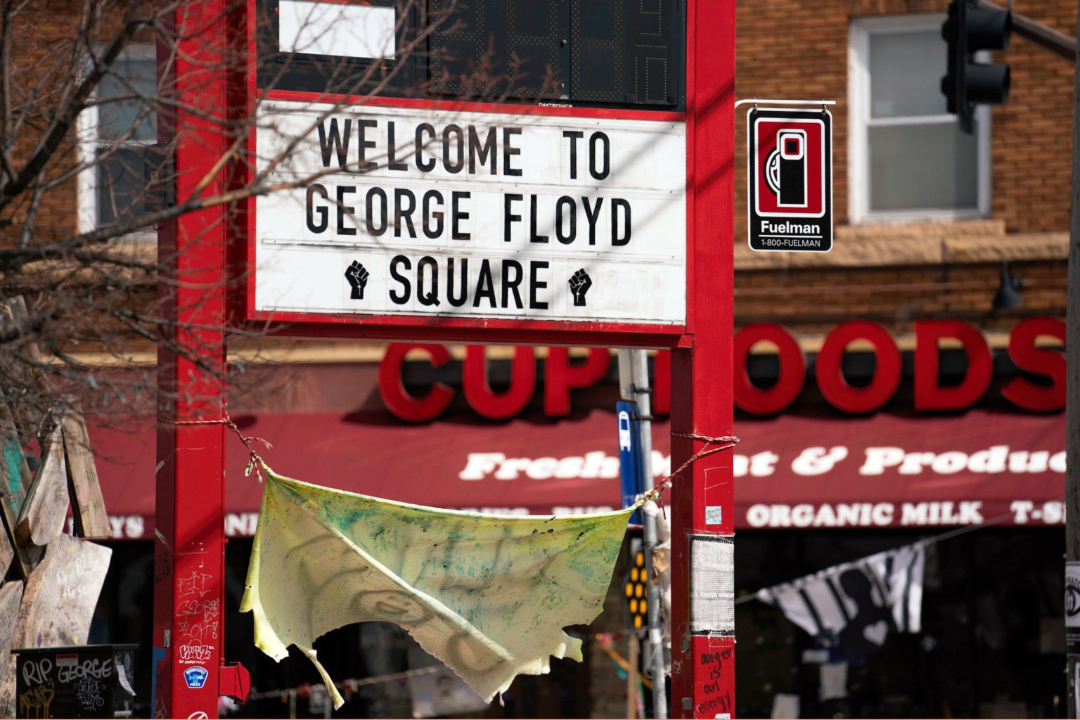 A "Welcome to George Floyd Square" sign at the intersection of East 38th Street and Chicago Avenue in March 2021. (Lorie Shaull/Flickr)