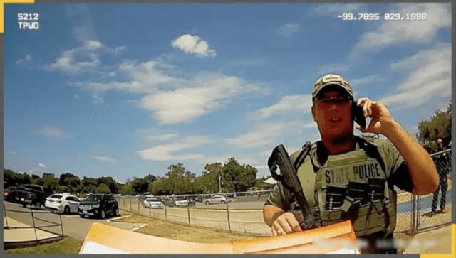 Texas Ranger Christopher Ryan Kindell outside Robb Elementary School in Uvalde on May 24, 2022, when 19 people 17 children and two adults were killed by a gunman. Kindell was fired by DPS Thursday and said he plans to appeal. (Texas Parks And Wildlife Bodycam, Texas Parks And Wildlife Bodycam)
