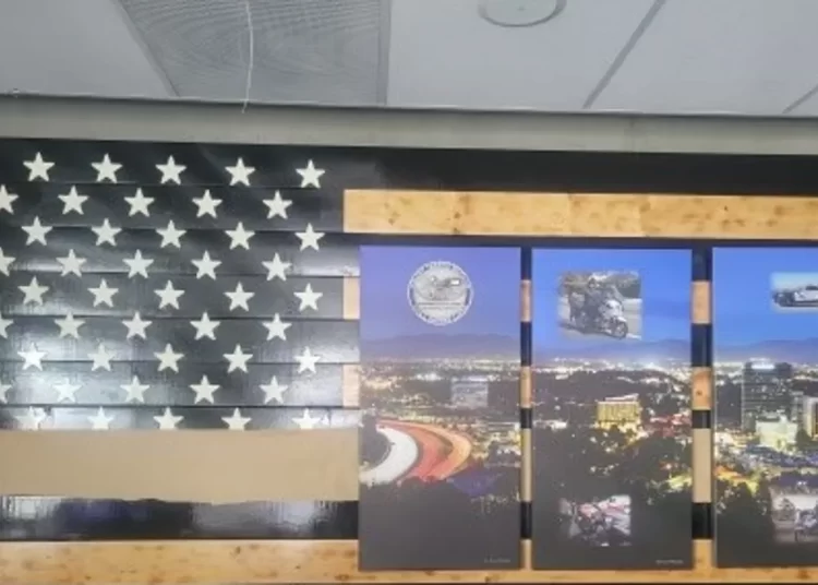 Image of the Thin Blue Line flag being masked at the LAPS Valley Traffic Division lobby. (Photo by Los Angeles Police Protective Union)