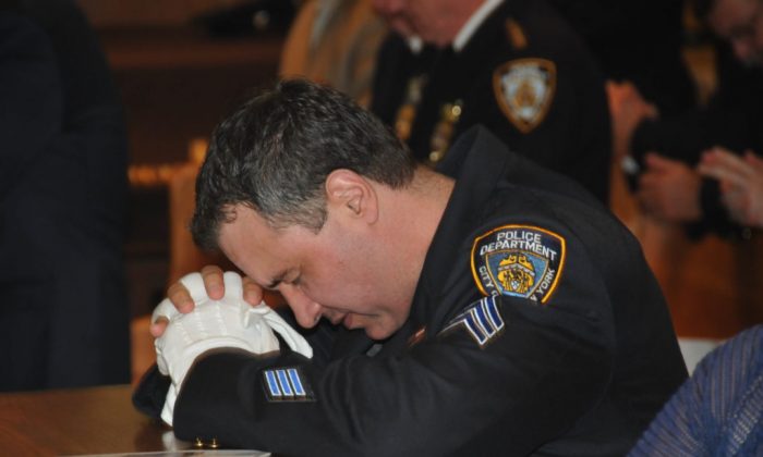 NYPD sergeant at prayer (Photo credit: NYPD)