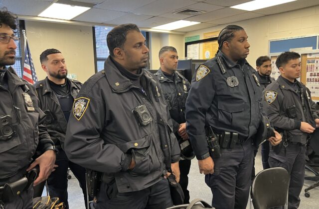 NYPD officers at the 3 p.m. roll call, 94th Precinct, Brooklyn, February 5, 2026, listening attentively to Vincent Bove speak on ethical leadership, resiliency, and suicide prevention.