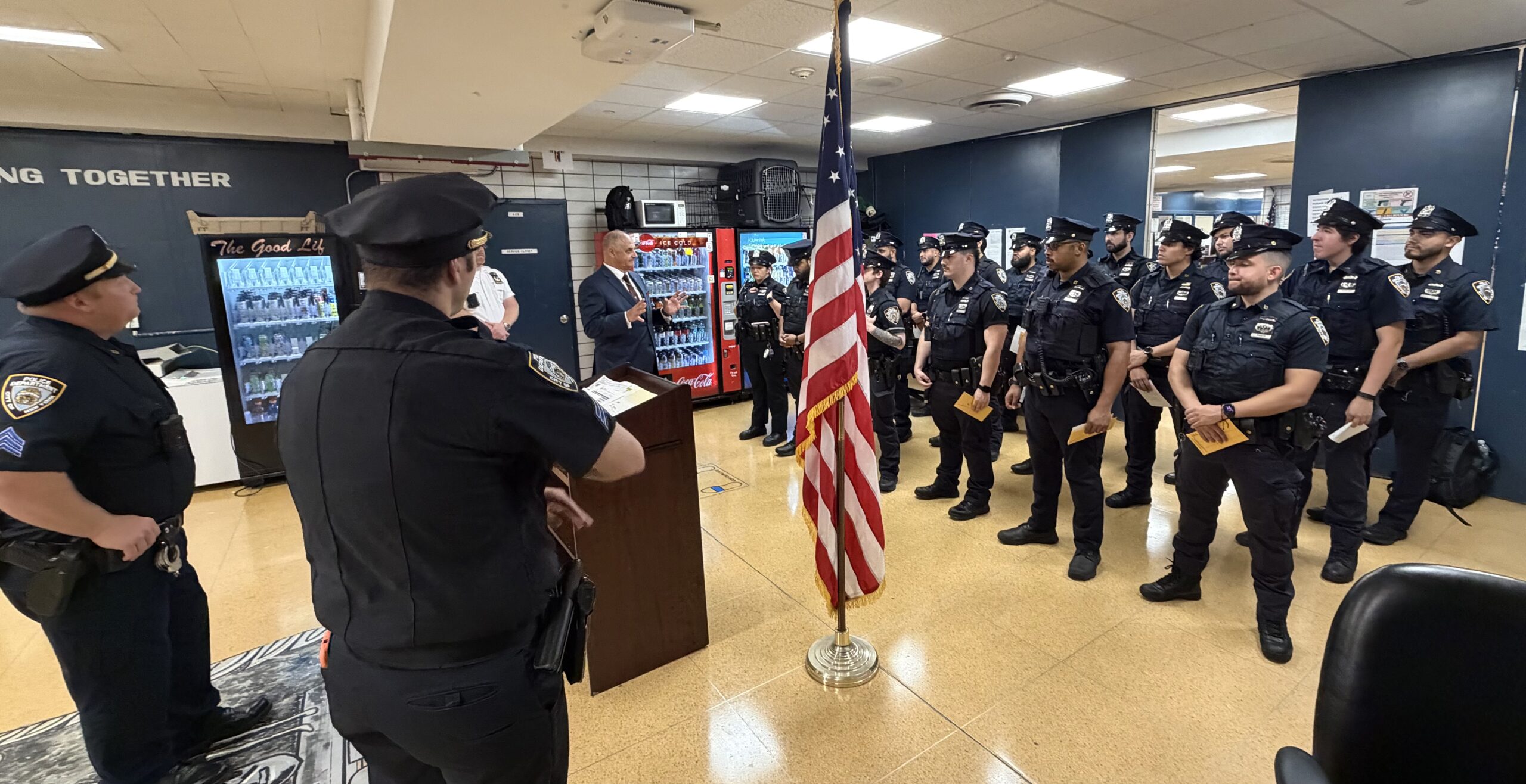 Vincent J. Bove, Honorary NYPD Law Enforcement Motivational Speaker, addresses members of the NYPD 13th Precinct in Manhattan during combined day and evening roll calls on August 28, 2026. His remarks focused on ethical leadership, morale, emotional fortitude, pride in the profession, and the dignity of the 21st-century protector. He placed an American flag beside him as a respectful symbol throughout the presentation.

Photo Credit: Reawakening America LLC Collection