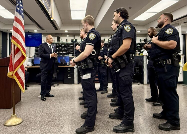 Vincent J. Bove addresses NYPD officers during a Midtown South Precinct roll call on September 4, 2026, with the American flag he personally brought into the muster room before the first roll call prominently displayed beside him.
Credit: NYPD Captain Benjamin M. Bellingeri for Reawakening America LLC