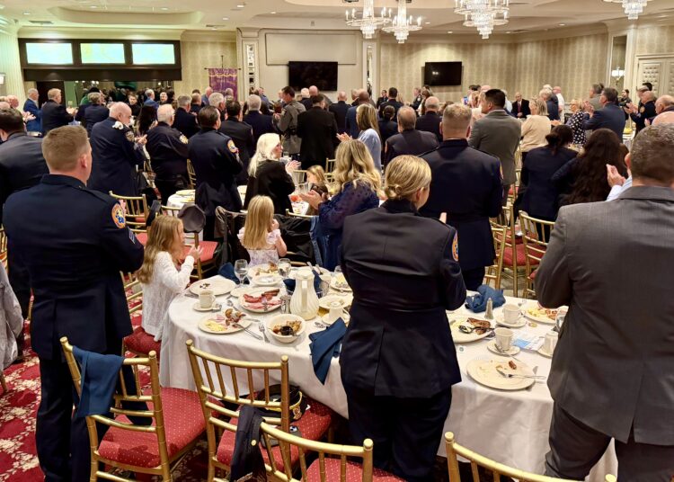 Members and guests of the Police Holy Name Society of Nassau County stand during the September 20, 2026, Communion Breakfast. Vincent J. Bove, CPP, received a standing ovation following his keynote presentation.
Credit: Photo by Reawakening America LLC