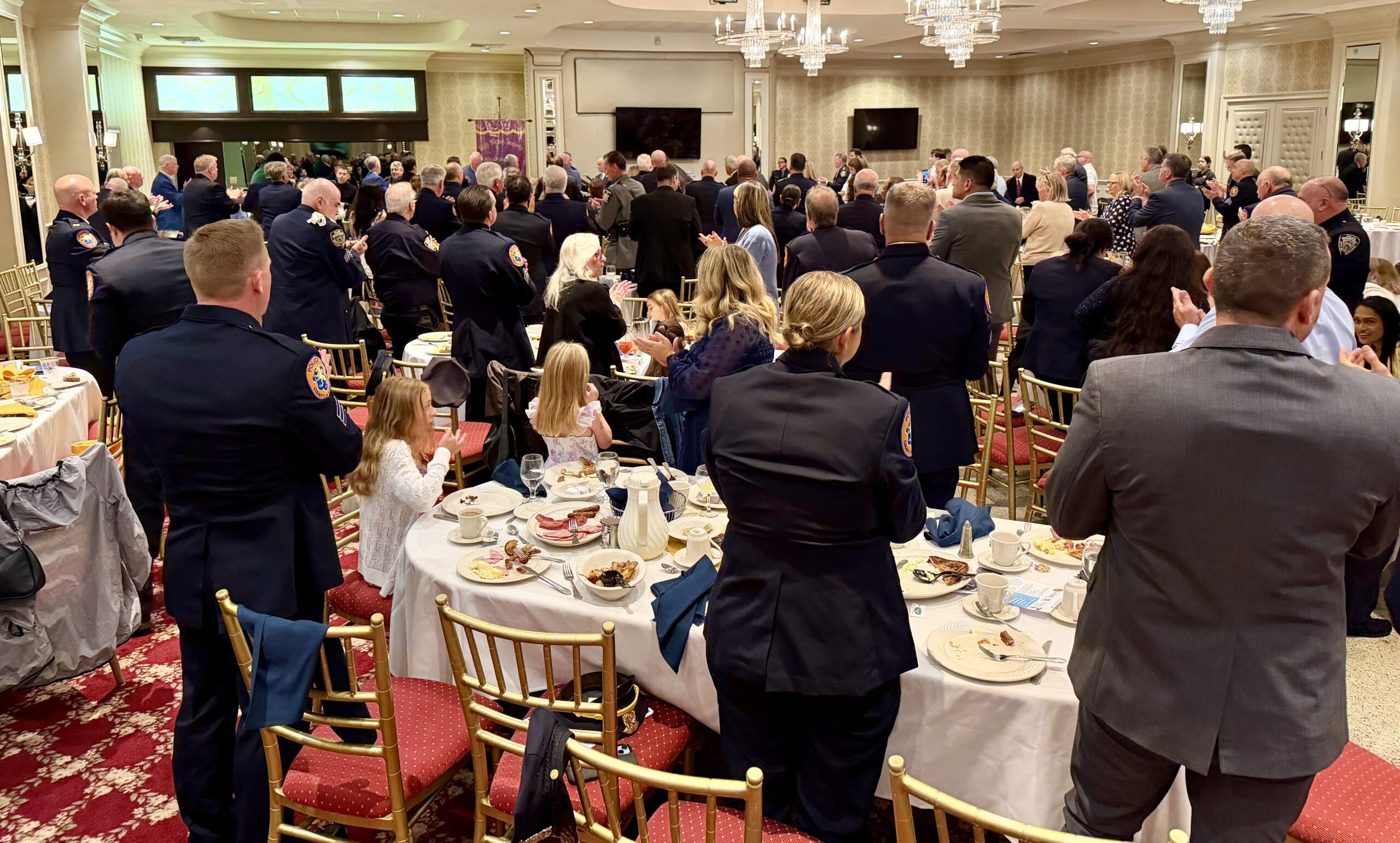 Members and guests of the Police Holy Name Society of Nassau County stand during the September 20, 2026, Communion Breakfast. Vincent J. Bove, CPP, received a standing ovation following his keynote presentation.
Credit: Photo by Reawakening America LLC
