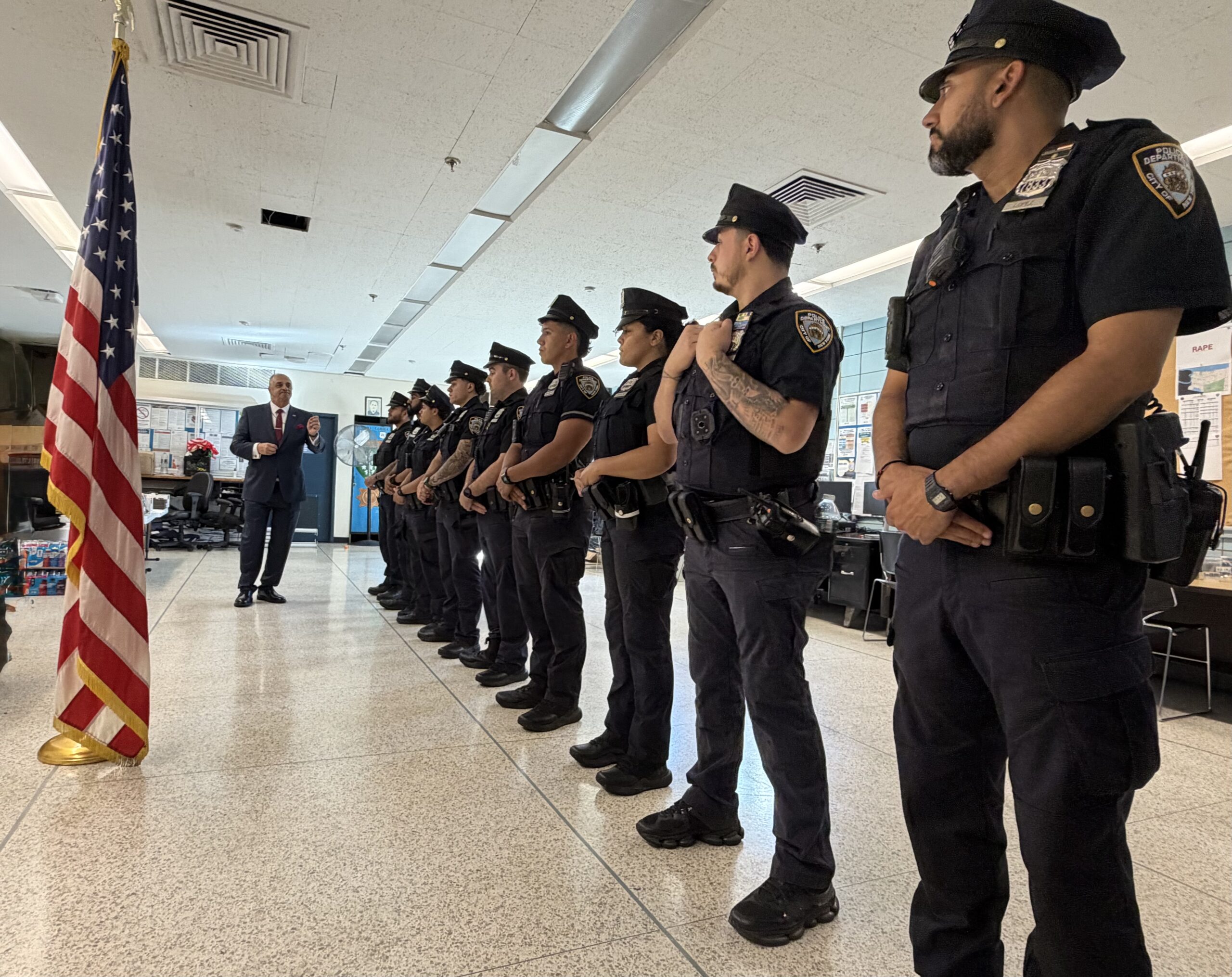 Vincent J. Bove addresses members of the NYPD during a formal roll call on the 25th anniversary of September 11, with the American flag brought forward as a symbol of remembrance, service, and the sacred responsibility of those who protect others.
Photo Credit: NYPD for Reawakening America LLC