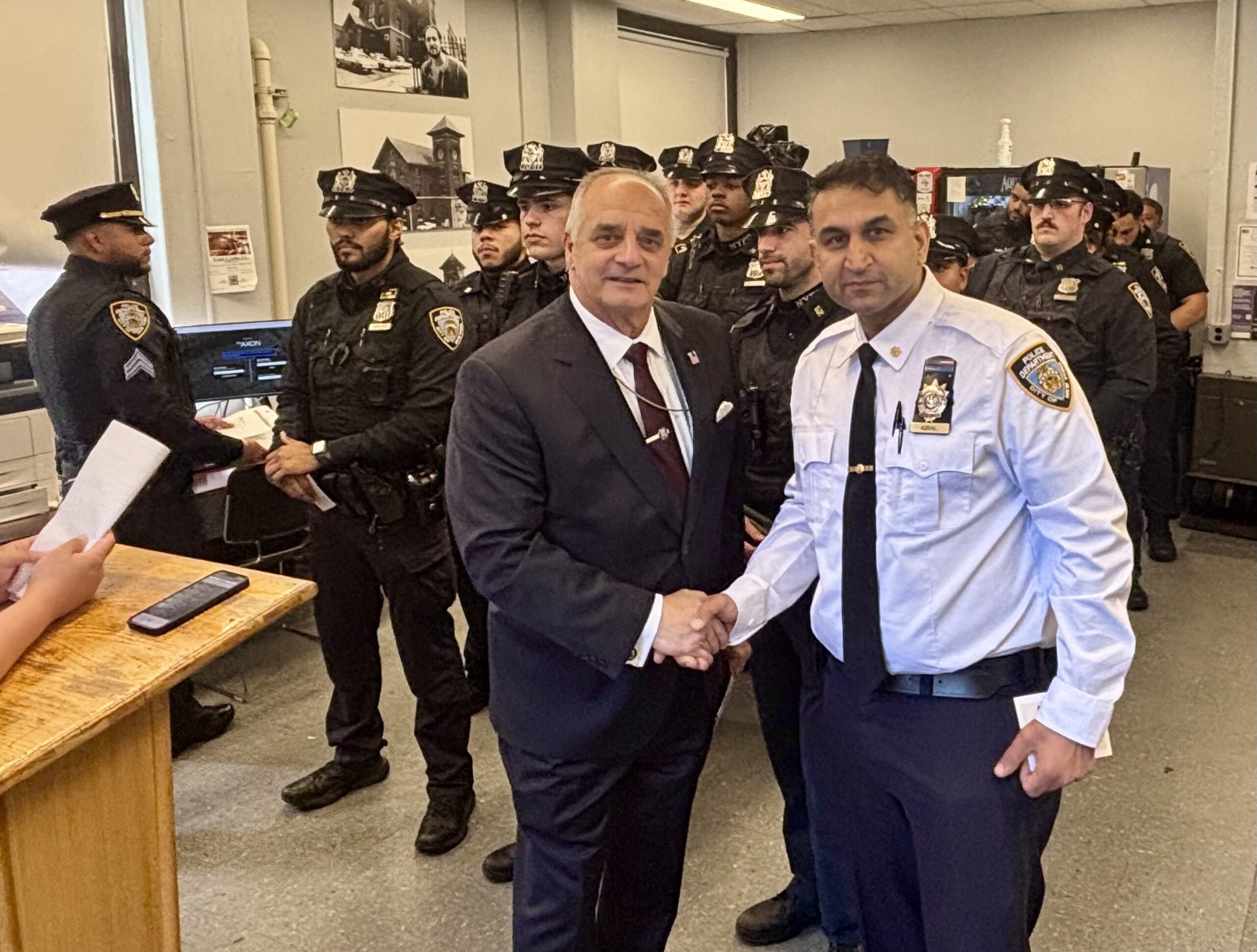 Vincent J. Bove stands with Deputy Inspector Asif Iqbal, Commanding Officer of the NYPD’s 52nd Precinct, following Bove’s roll call remarks on October 7, 2026. The encounter reflects a shared commitment to affirming and supporting the men and women who protect the community.
(Photo courtesy of the NYPD for Reawakening America LLC.)