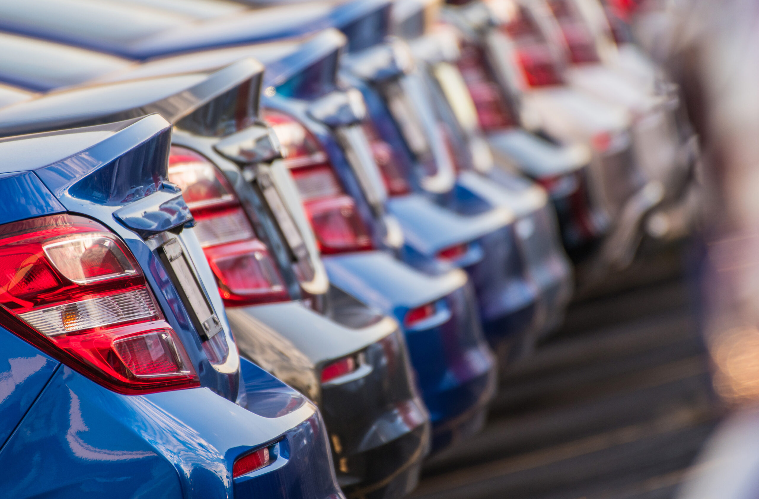 Row of cars at a car dealership