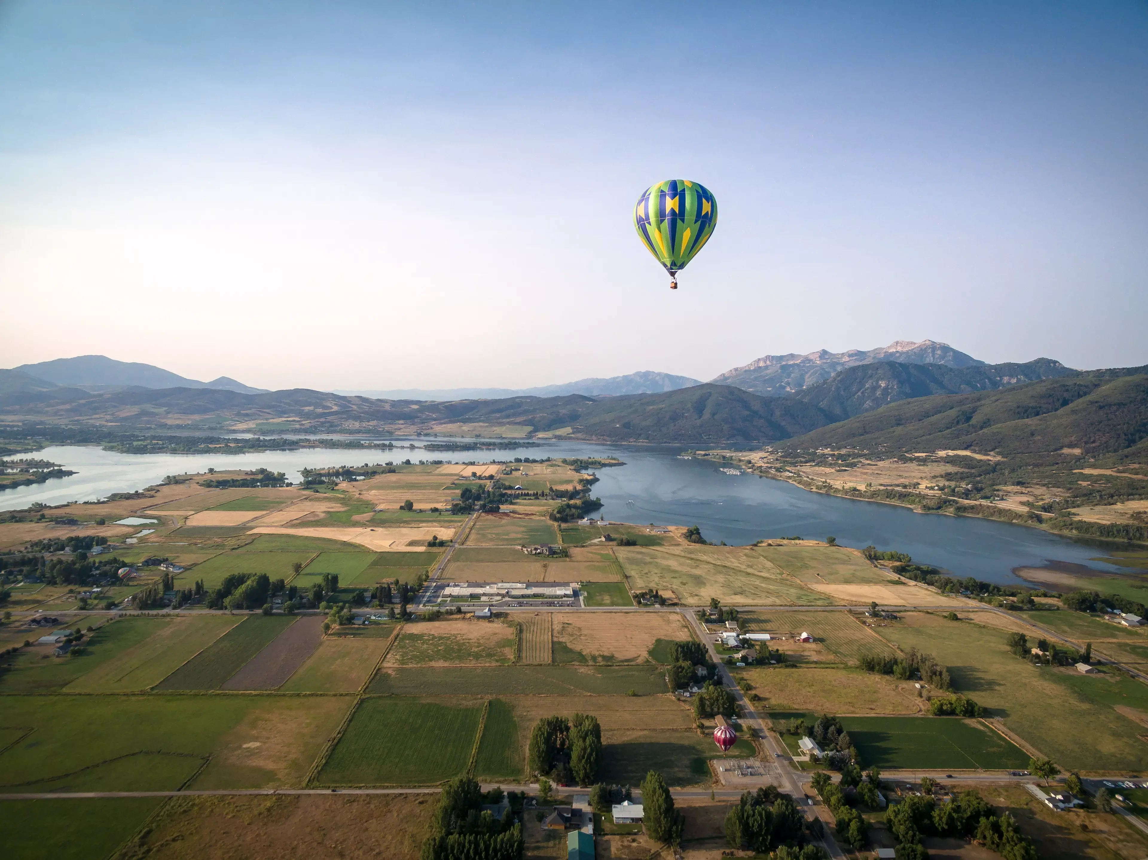 Green Hot Air Balloon Flying over Eden, Utah