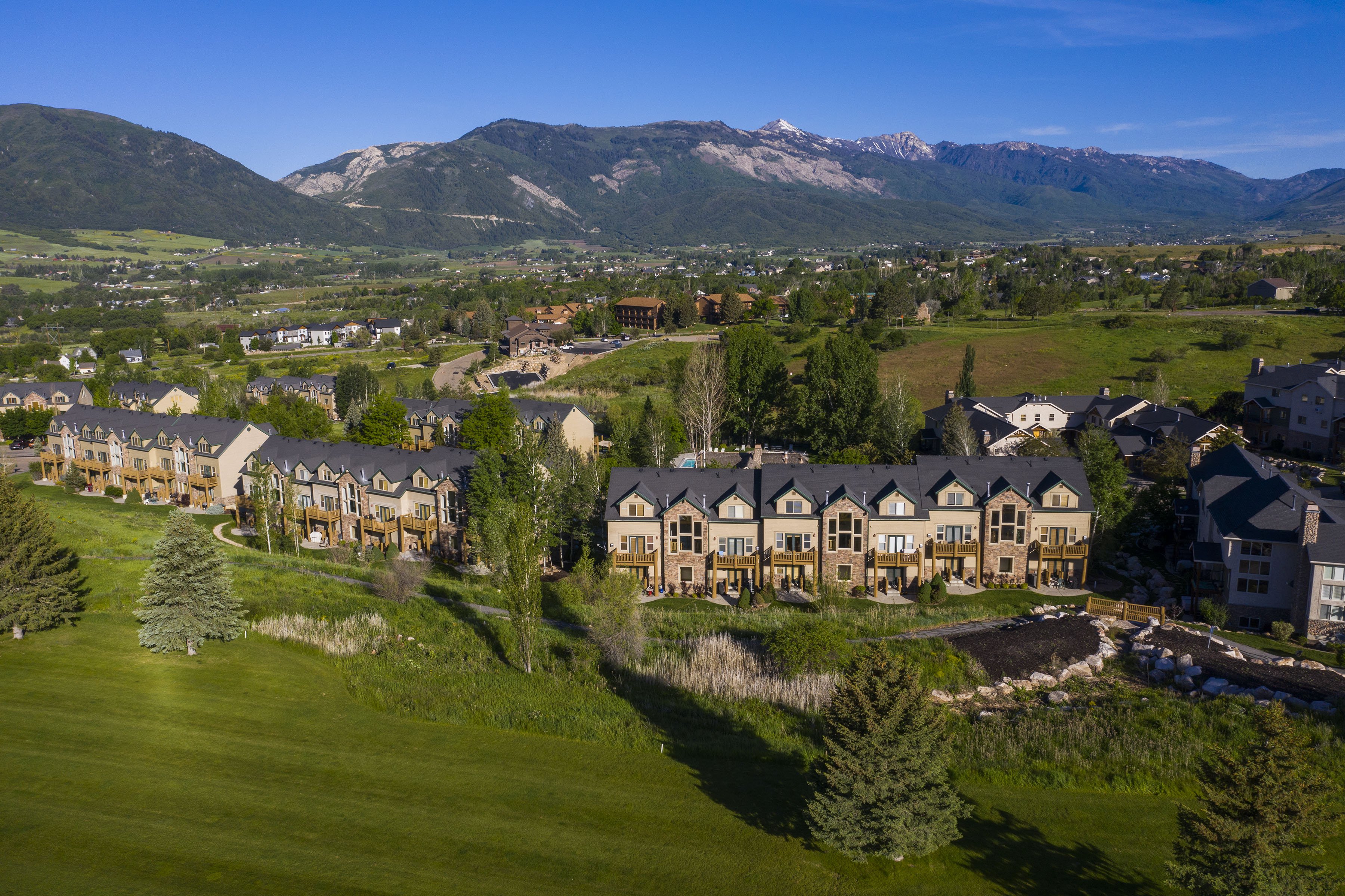 Beautiful Drone Shot of Moose Hollow Condos Showing Golf Course and Mountain Views
