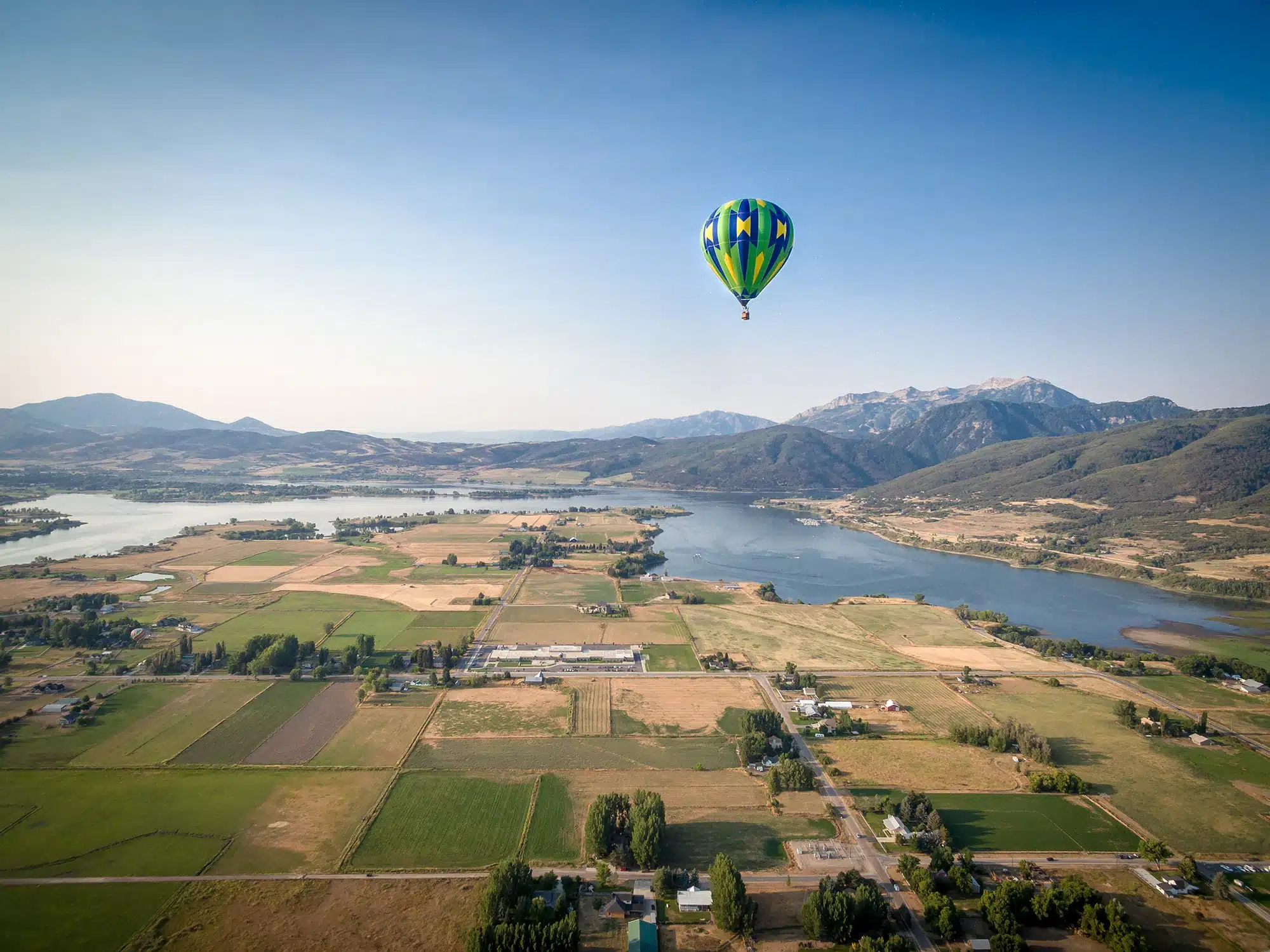 A hot air balloon floats over Ogden Valley.