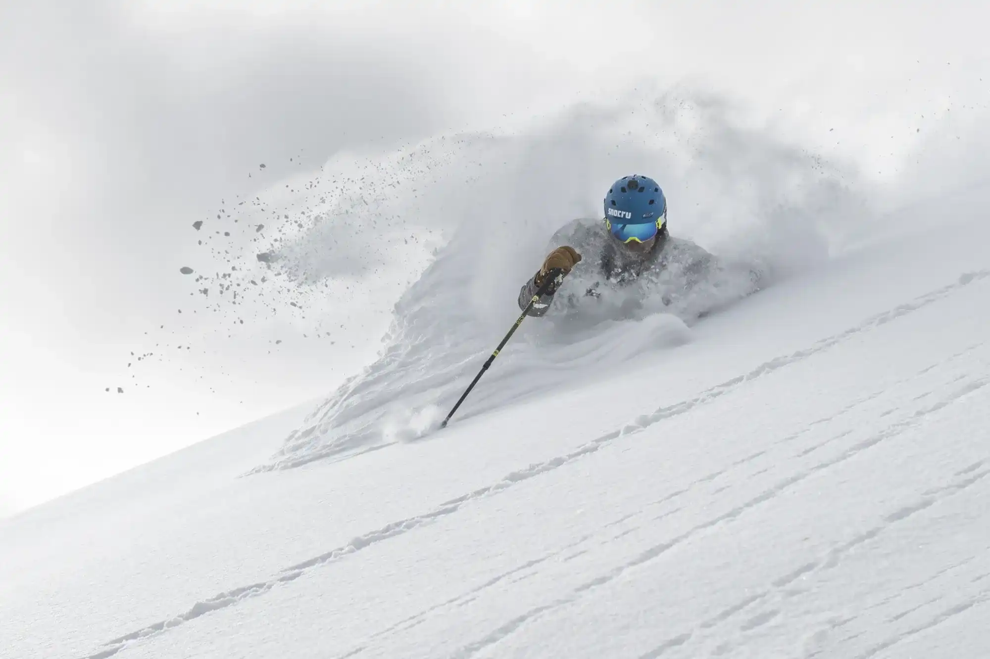 A skier cruising through steep and deep powder at Solitude.