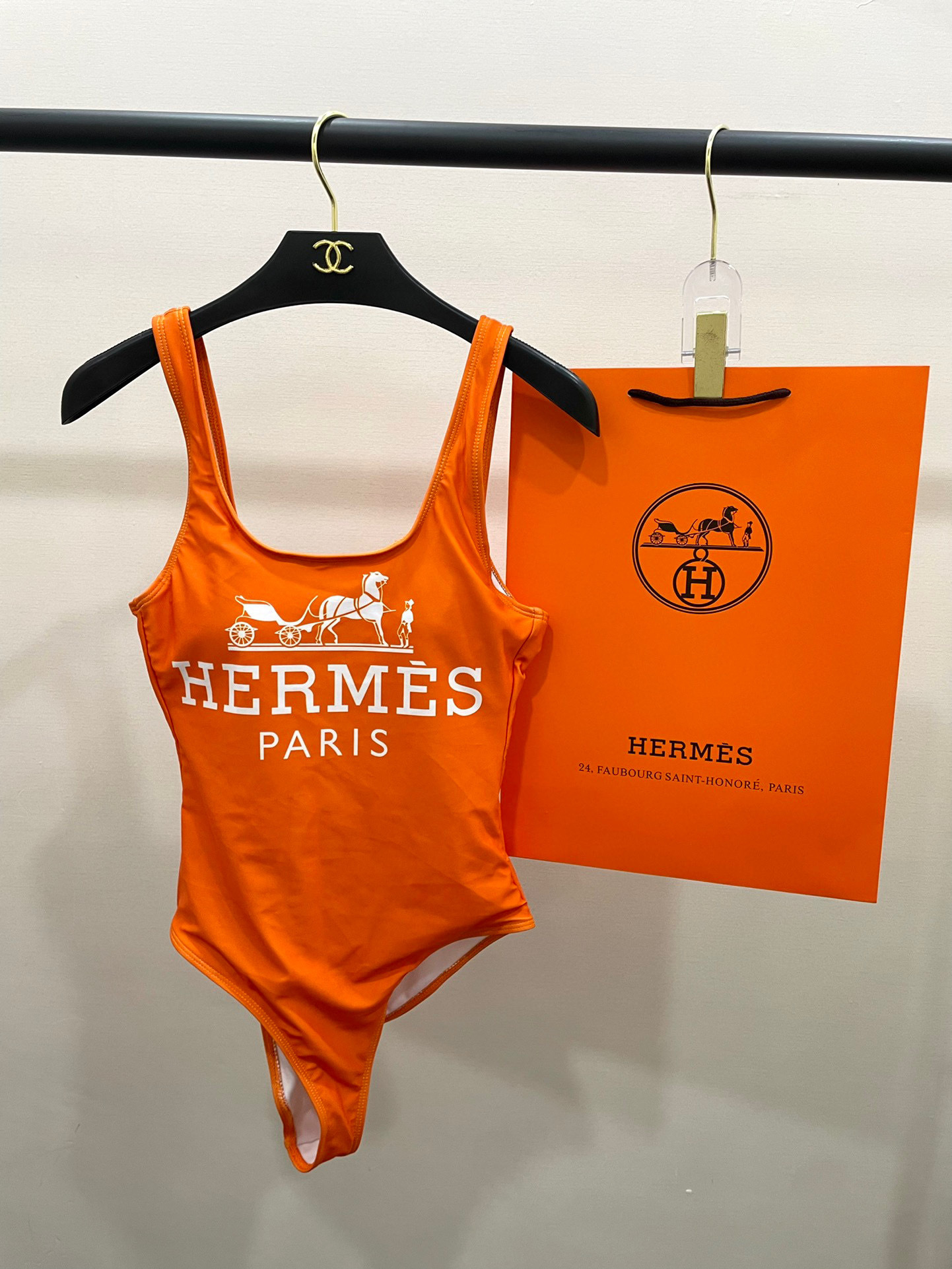 Hermès Orange Premium Swimsuit on hanger