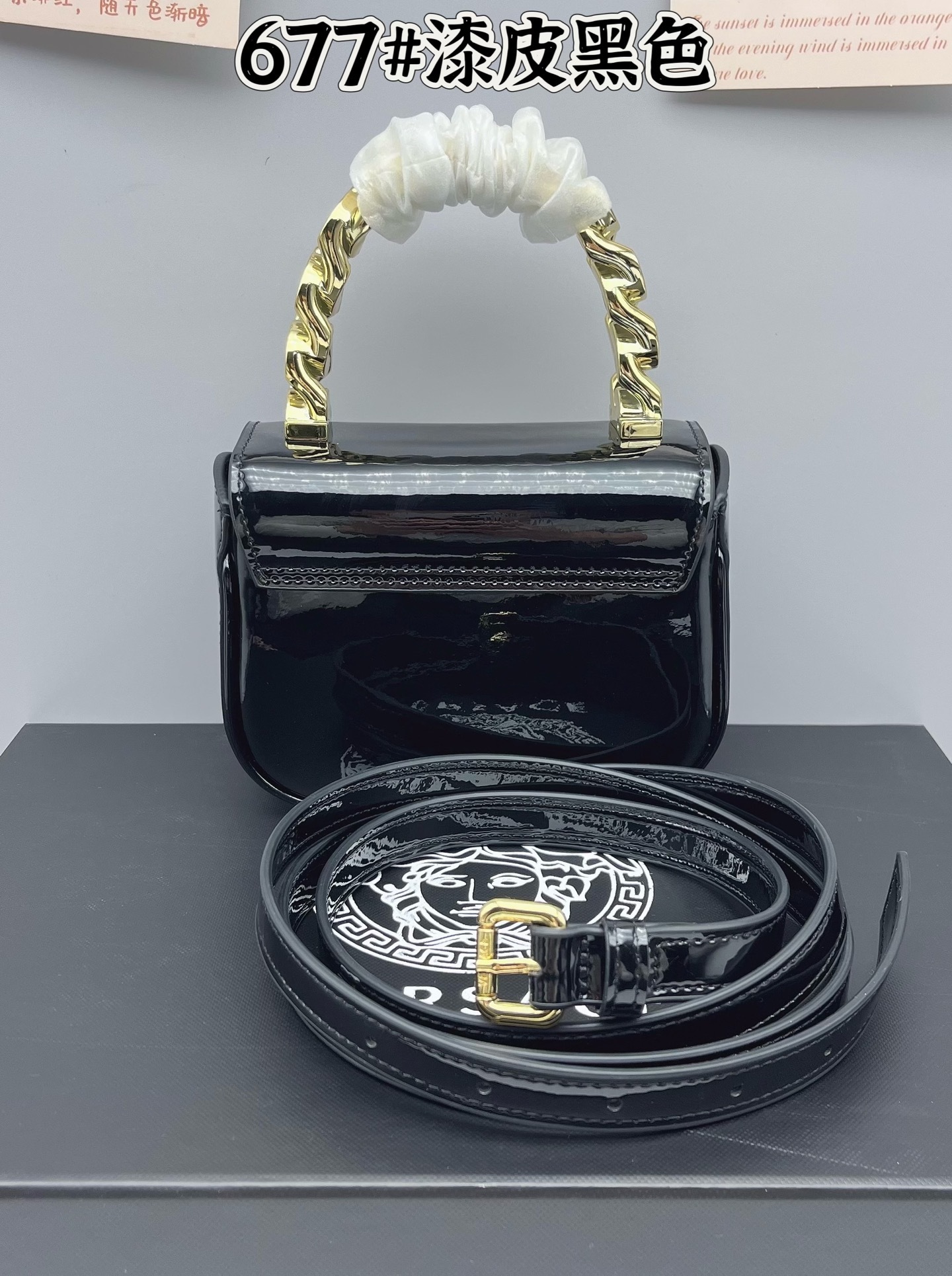Versace Medusa Patent Bag, black glossy luxury handbag with gold handle and strap.