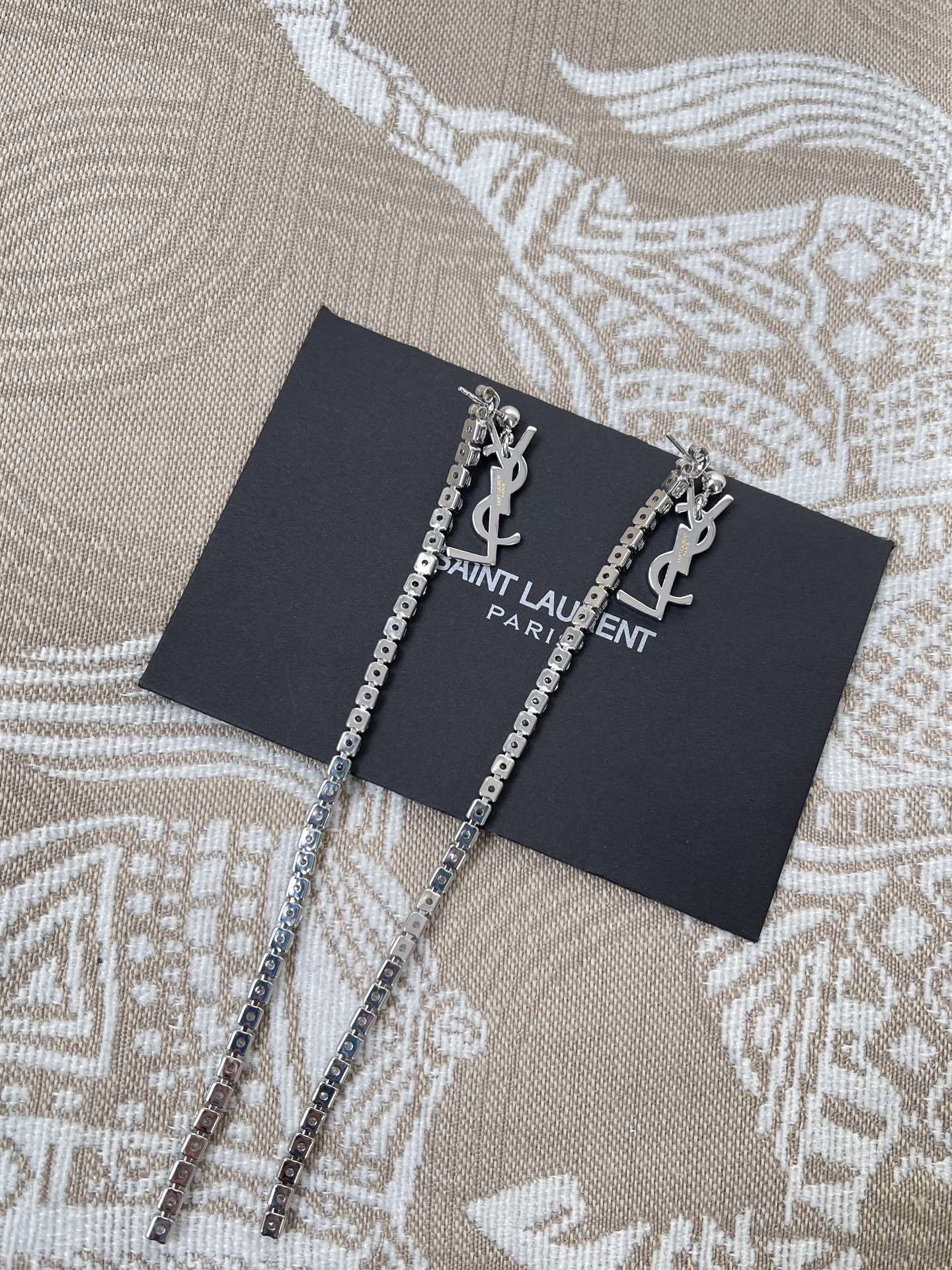 Saint Laurent Silver Star Tassel Earrings – Designer Sparkle