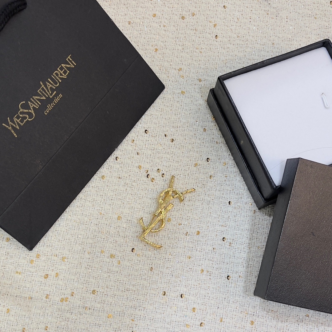 designer Yves Saint Laurent Gold YSL Brooch – Yves Saint Laurent Gold
