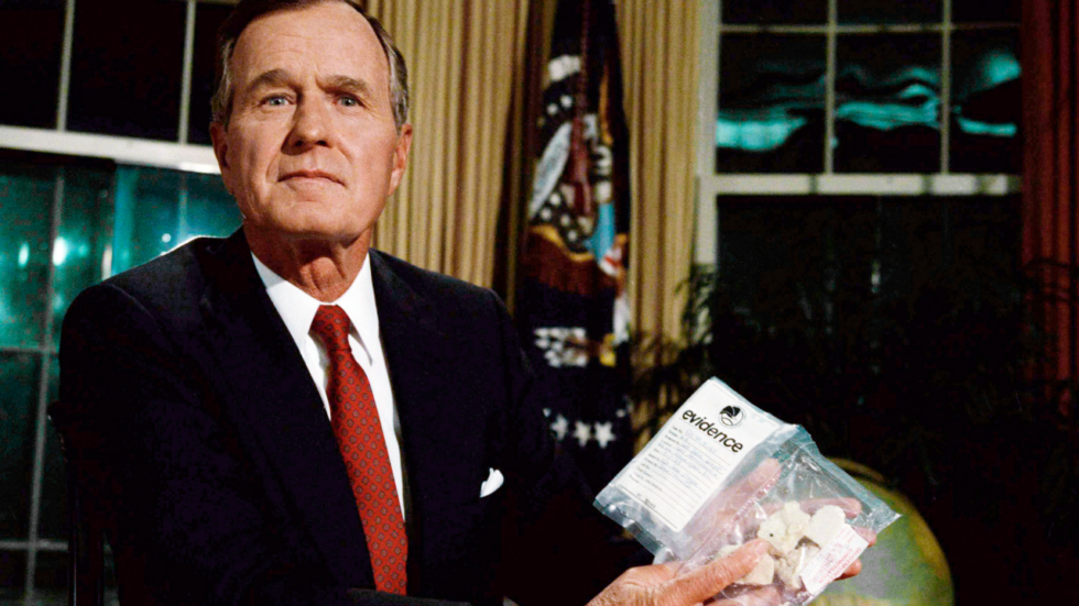 hw bush holding a bag of crack