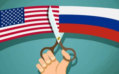 usa and russian flags are cut with scissors. confrontation and t