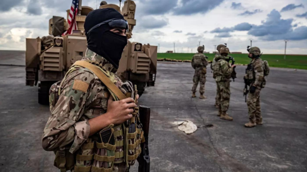 sdf soldier with us forces in syria