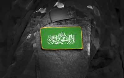 flag of hamas on military uniform (collage).