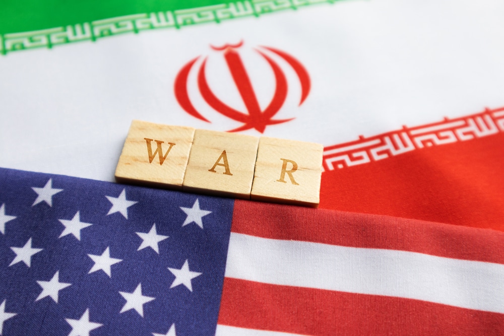 concept of bilateral relations of us and iran showing with flag and war with wooden block letters