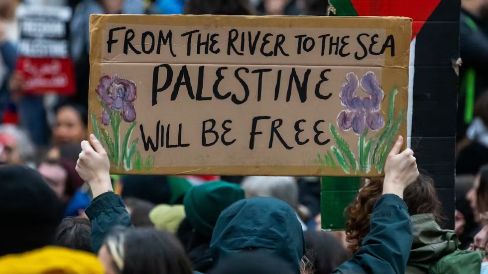 river to sea sign palestine protester
