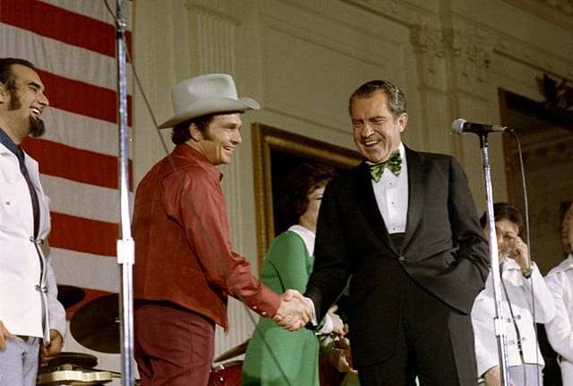 president richard nixon shaking hands with country music performer merle haggarda