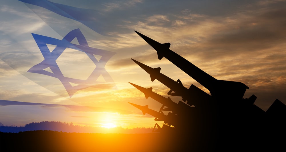 the missiles are aimed at the sky at sunset with israel flag. nuclear bomb, chemical weapons, missile defense.