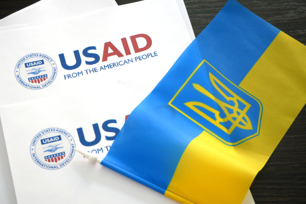 kiev, ukraine 02 12 2023: usaid logo and ukrainian flag, usaid